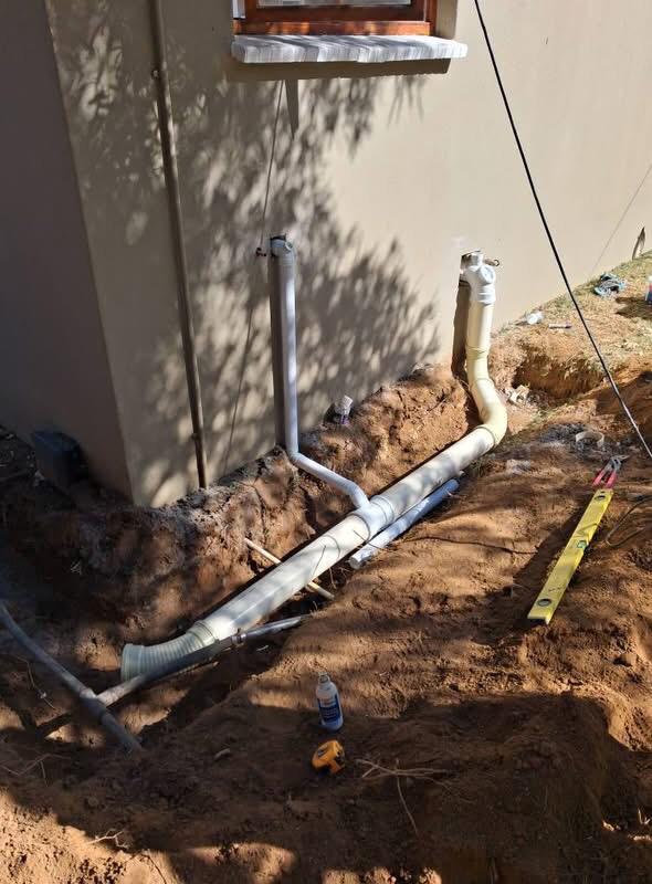 High-pressure drain line reroute