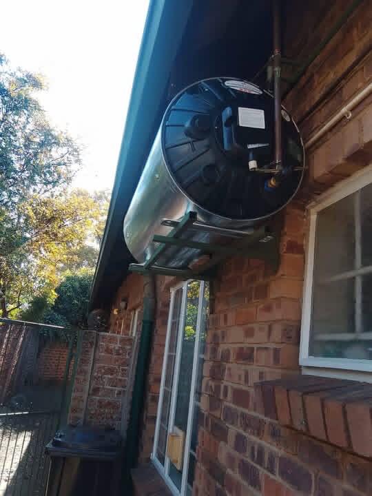 External geyser installation on brickwork